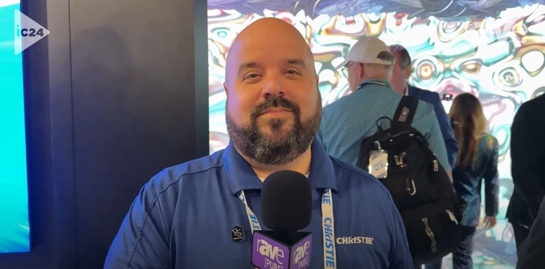 Video thumbnail: A person holding a microphone standing in front of Christie MicroTiles LED tiles
