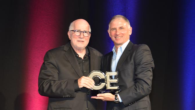 Bob Sunshine (left) accepts Mr. Ruoquing’s and CINITY’s Technical Achievement Award from Disney’s Jeff Forman, at CineEurope 2022.