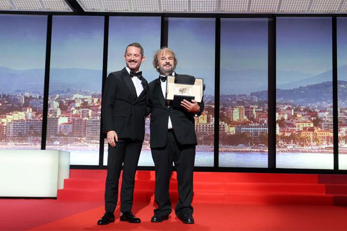 (Right) Sir Peter Jackson, film director, receives honorary Palme d'Or from Elijah Wood during the opening ceremony of the 79th international film festival, Cannes. Photo credit: Manon Boyer-FDC 