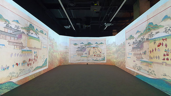 Walls are projected with images of landscapes and paintings.