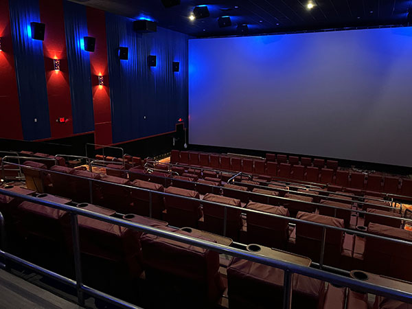  A dimly lit empty movie theatre.