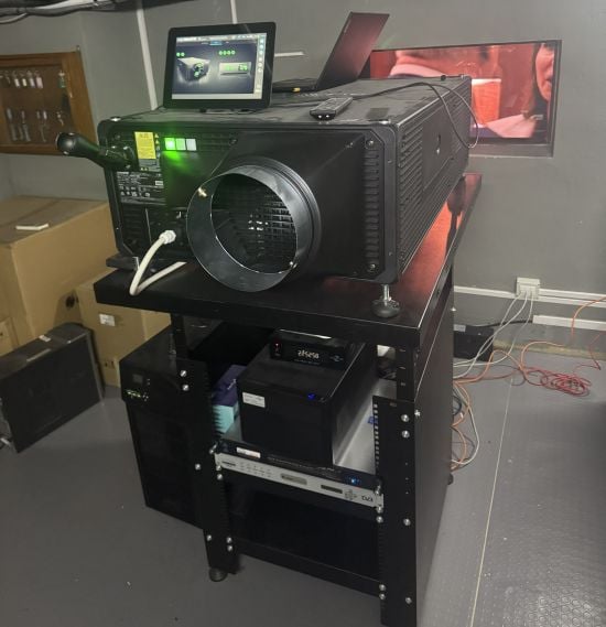 A Christie cinema projector in a projection booth.