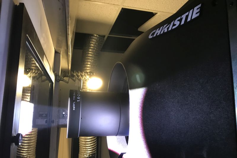 black movie projector in cinema booth