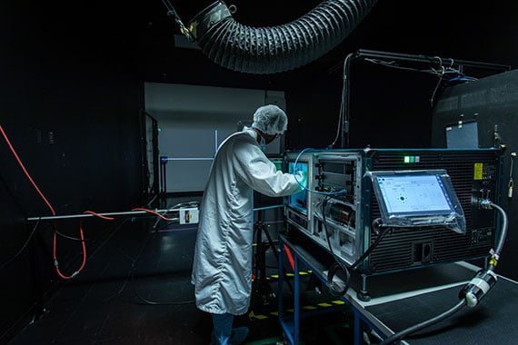 Professional Services technician working on a Christie projector