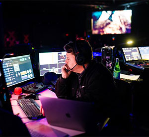 A person working in a broadcast control room