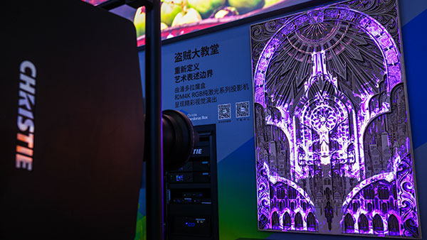 Cathedral of Thieves projection mapping display lit up in purple in the Christie booth at InfoComm China 2025